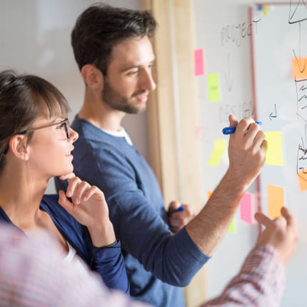 A group of digital marketing agency experts developing custom digital marketing strategy