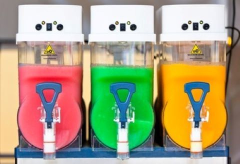 picture of three frozen drink machines with Vino Slush slushies